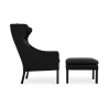 Buy Armchair with Footrest - Upholstered in Leather - Micah Black 15450 at Privatefloor